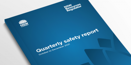 Image of a Resources Regulator report laying on a white background with the words quarterly safety report.
