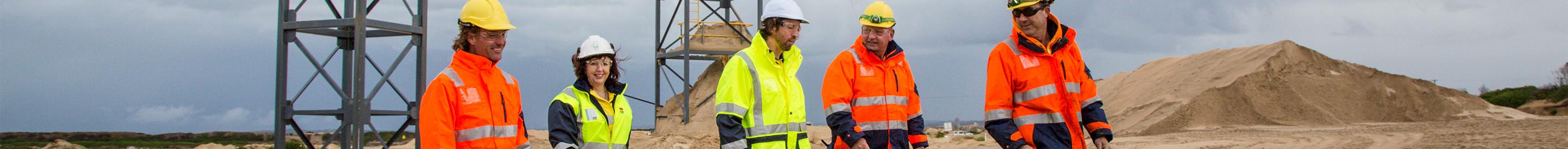 Five workers wearing hi vis at mine site