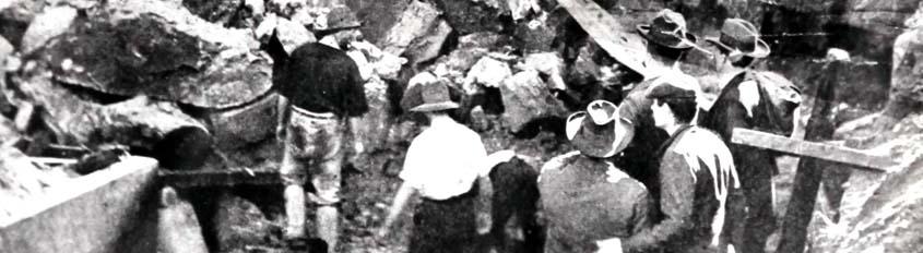 Black and white photo of workers at a collapsed mine